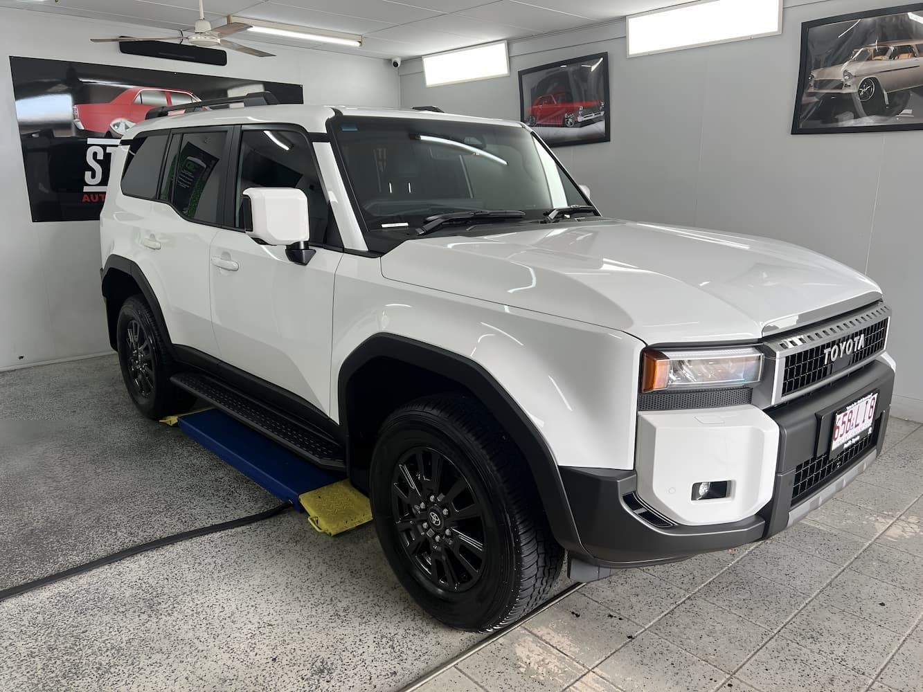 White SUV In a Garage — Straightline Detailing Cairns in Bungalow, QLD