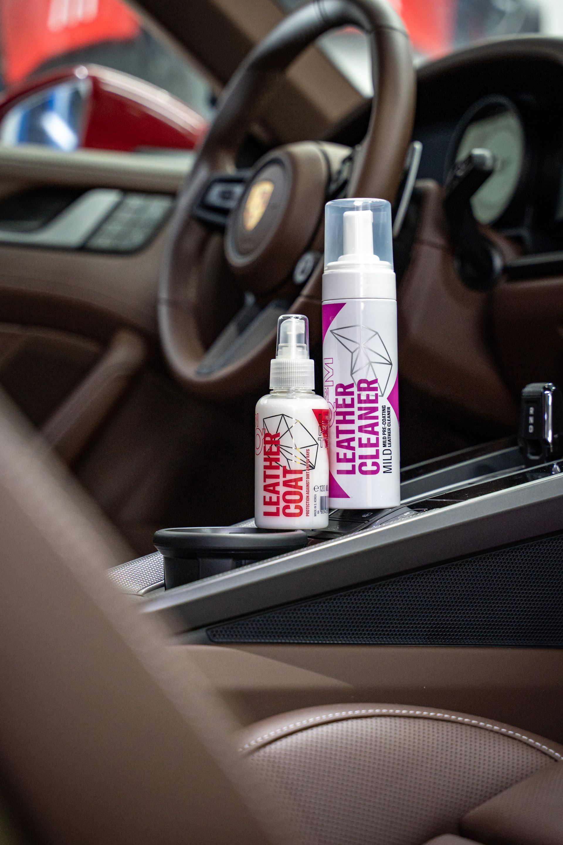 Two Car Care Spray Bottles in A Vehicle Center Console — Straightline Detailing Cairns in Bungalow, QLD