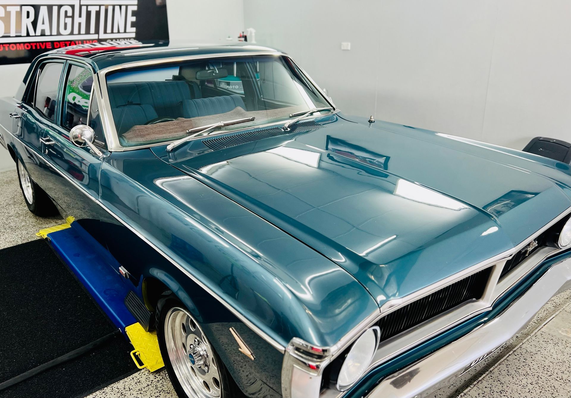 Classic Teal Vintage Car in A Showroom — Straightline Detailing Cairns in Bungalow, QLD