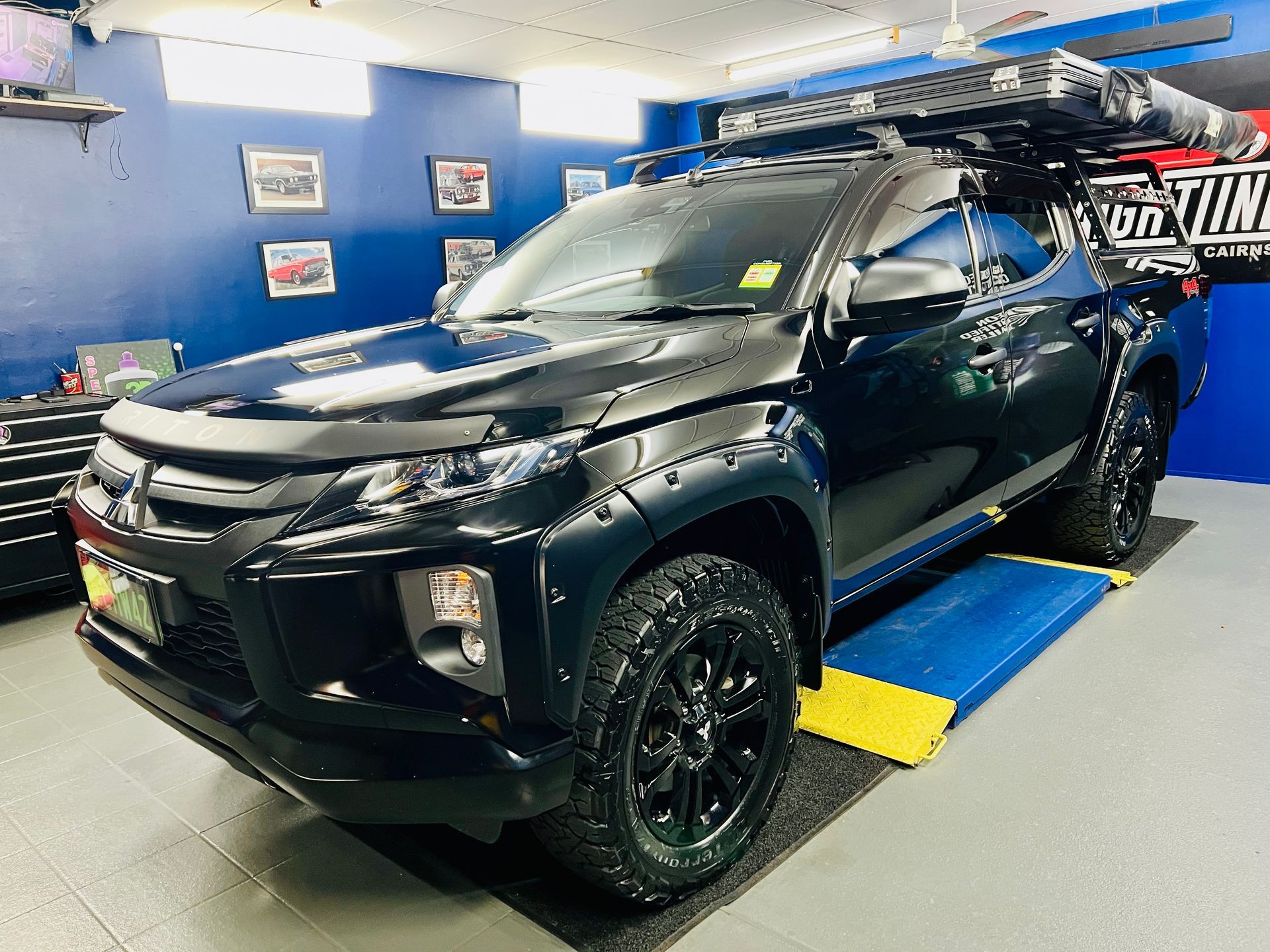 Black Pickup Truck in A Car Showroom — Straightline Detailing Cairns in Bungalow, QLD