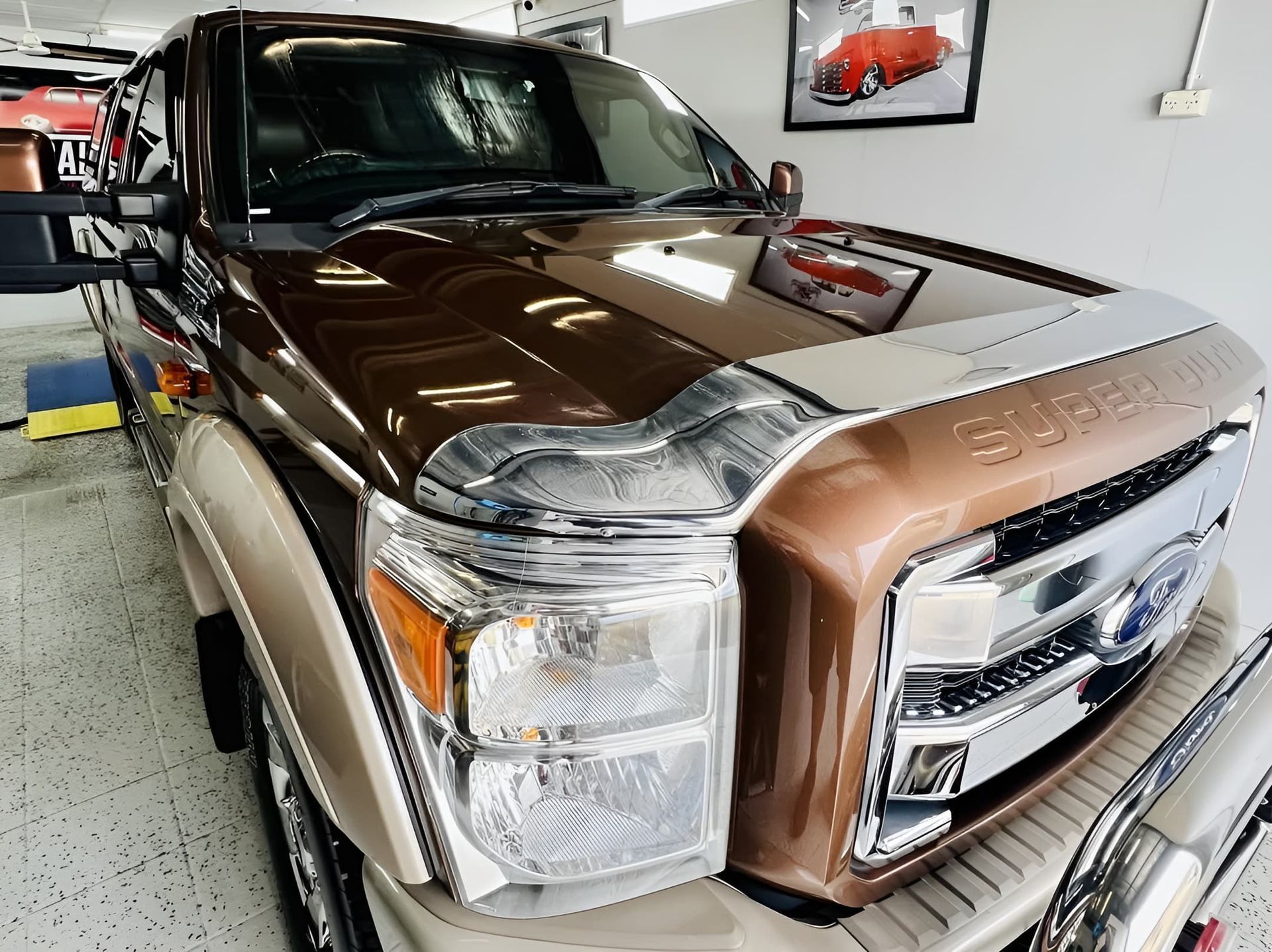 Brown Pickup Truck in A Showroom — Straightline Detailing Cairns in Bungalow, QLD