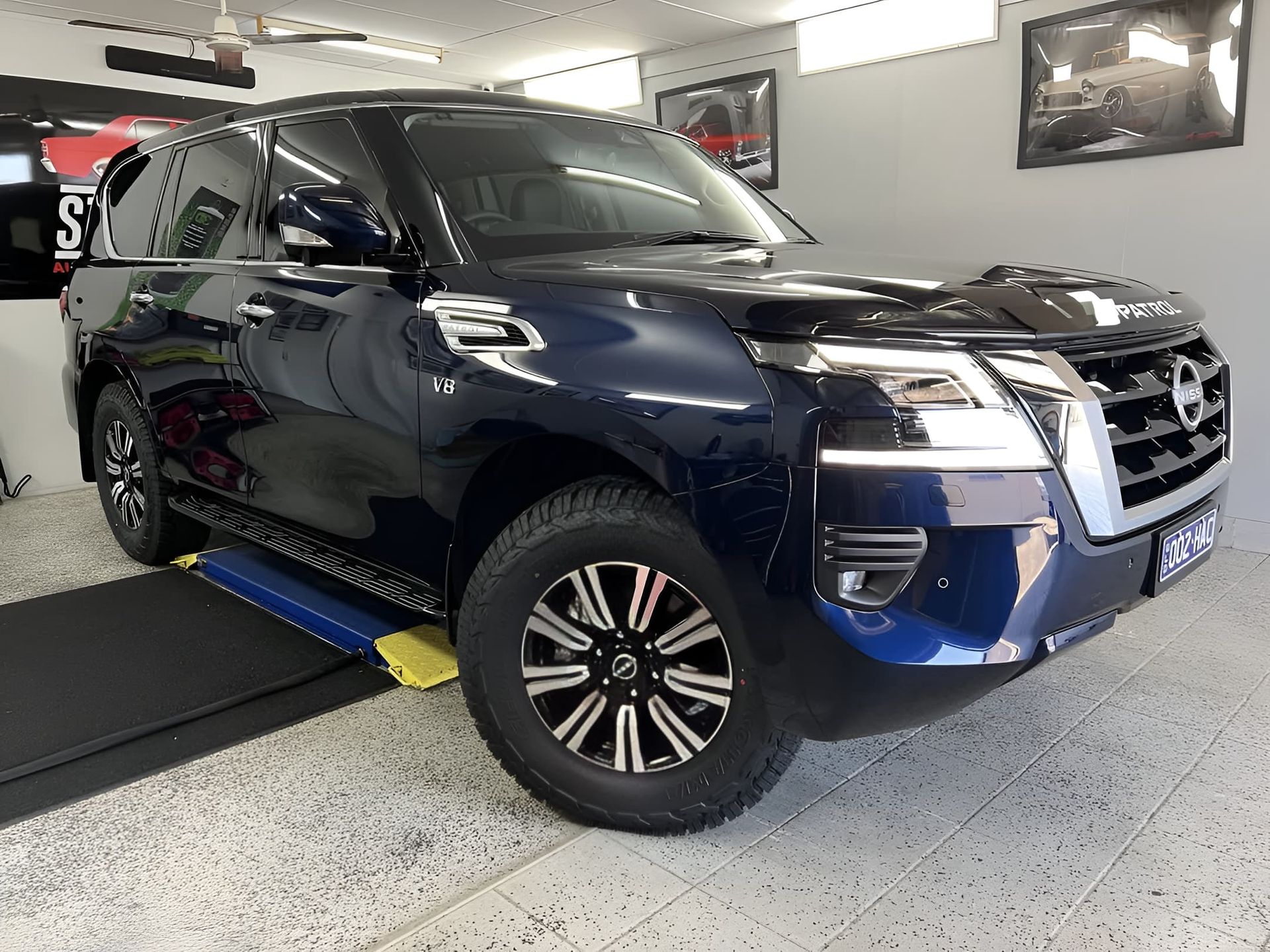 Blue SUV Displayed Indoors on A Car Platform — Straightline Detailing Cairns in Bungalow, QLD