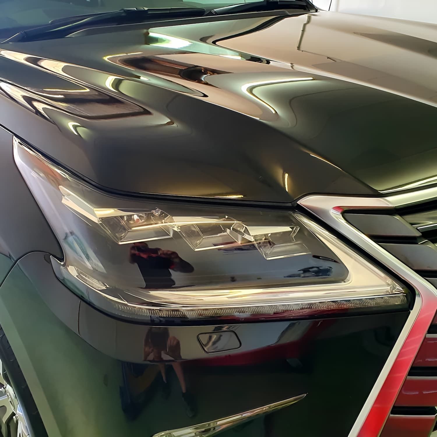 A Black Car With a Red Stripe on the Hood — Straightline Detailing Cairns in Bungalow, QLD