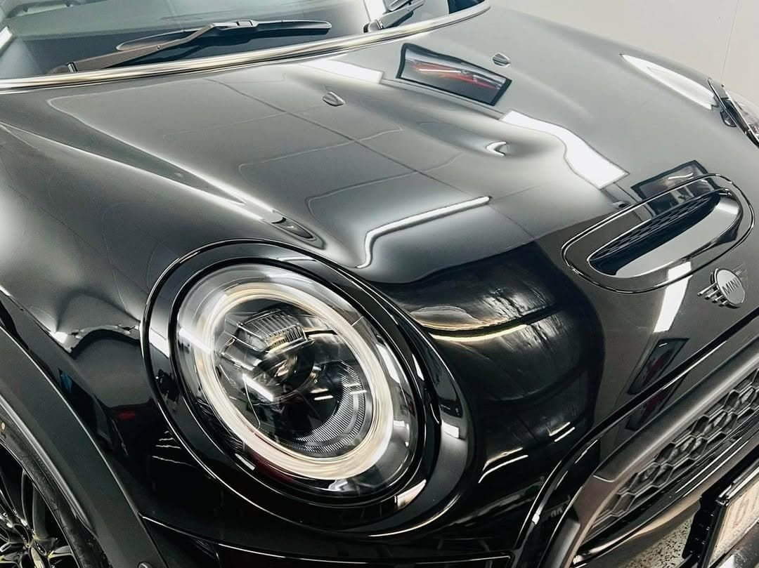 A Close Up of the Hood of a Black Mini Cooper — Straightline Detailing Cairns in Bungalow, QLD