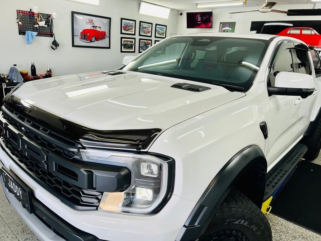A White Truck is Parked in a Garage — Straightline Detailing Cairns in Bungalow, QLD