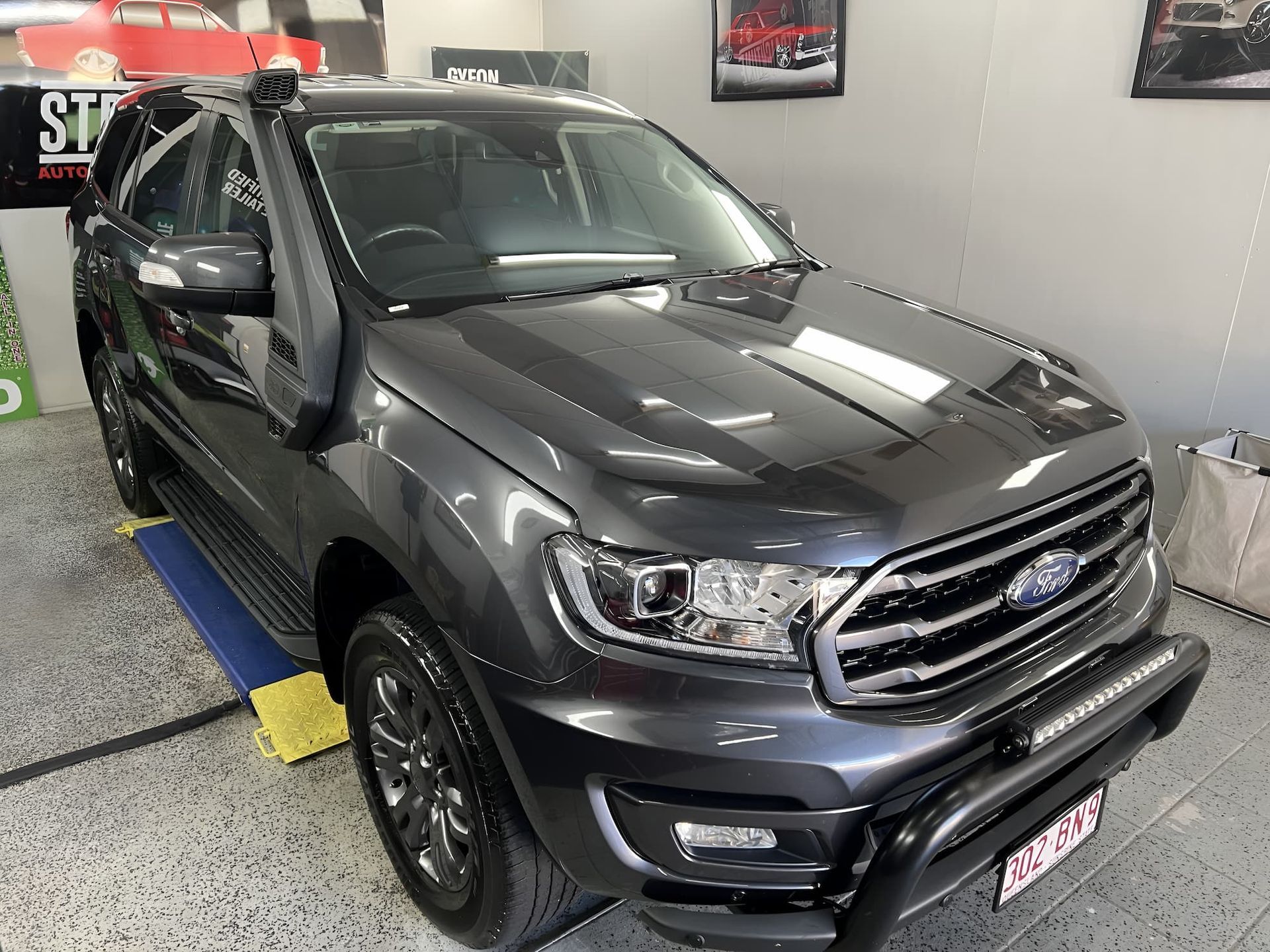 Dark Gray Subaru SUV In an Indoor Showroom — Straightline Detailing Cairns in Bungalow, QLD