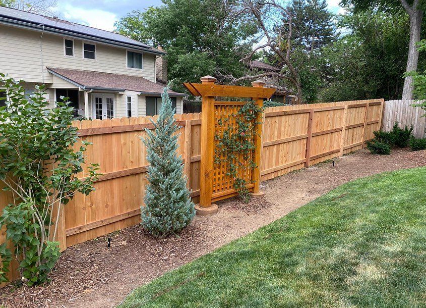 House Fence With Plants — Denver, CO — Marquez Fencing