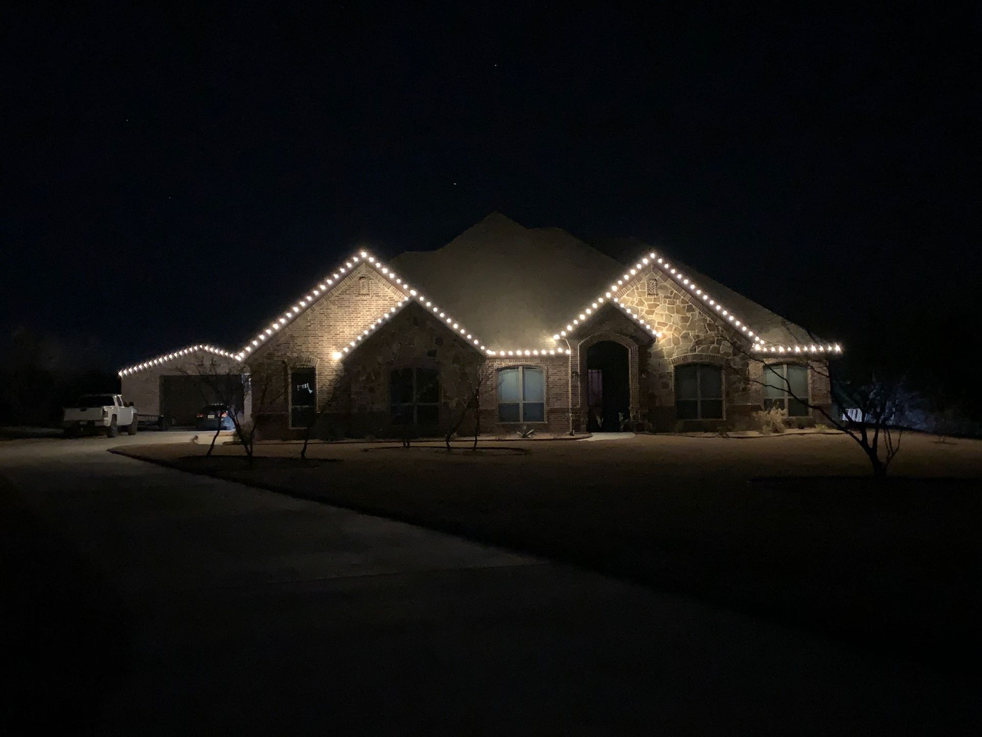 contemporary brick house white christmas lights