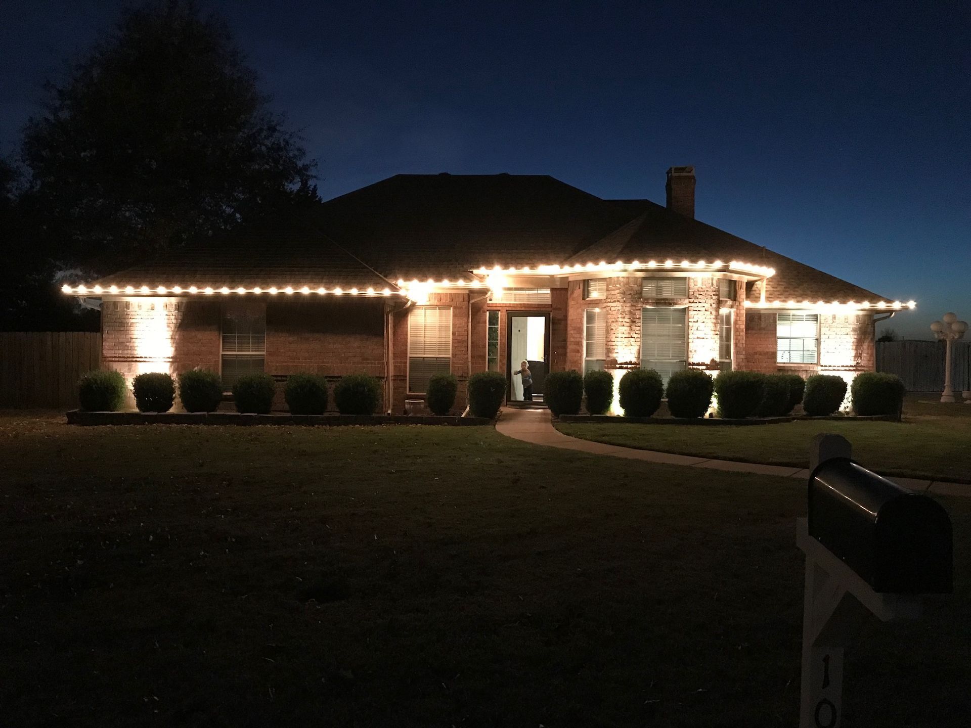 christmas lights brick home warm white