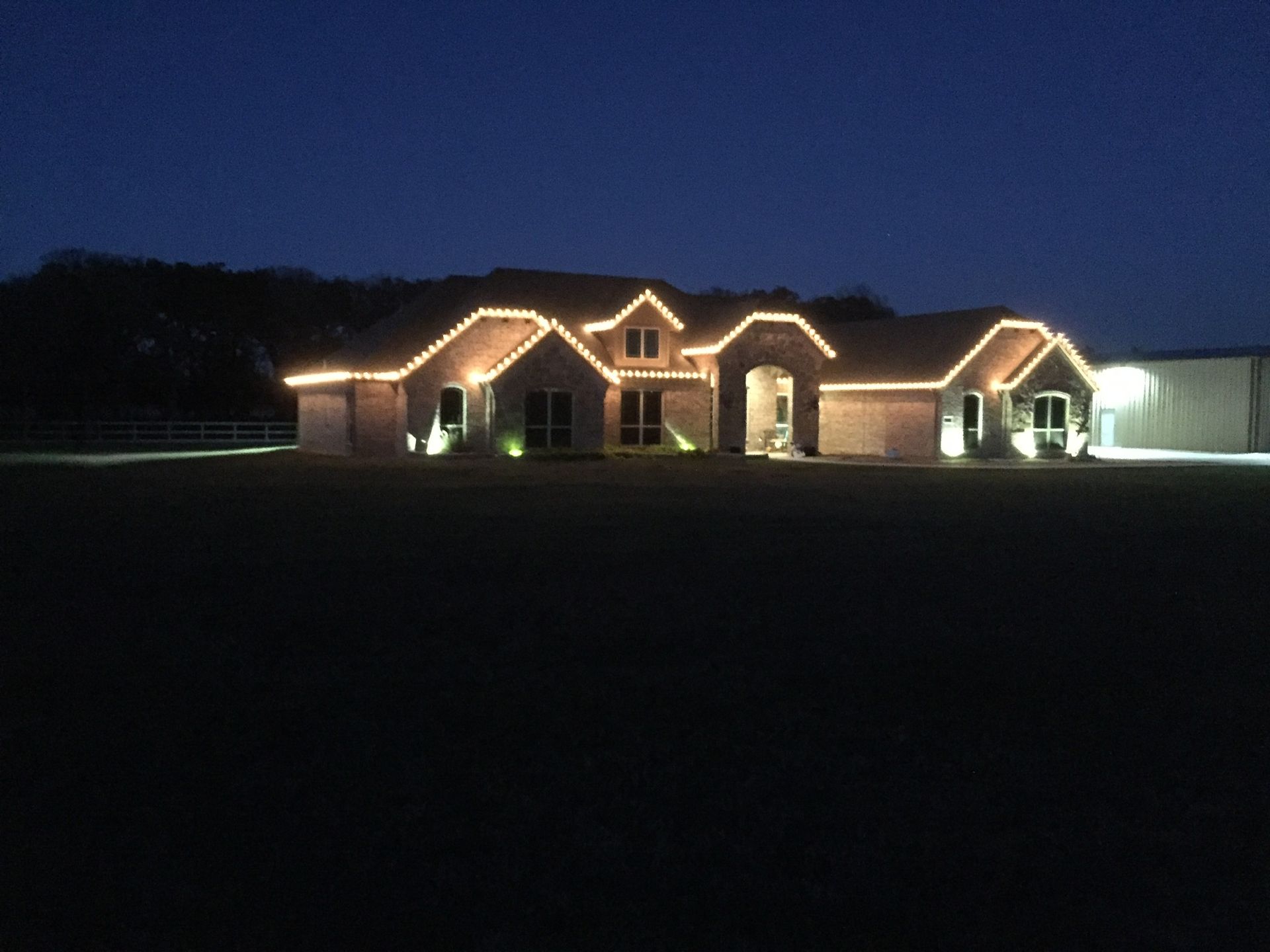 white christmas lights on brick home