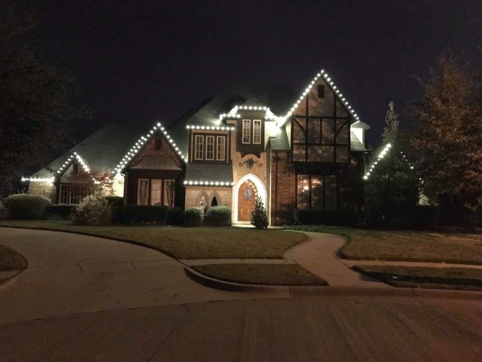 white christmas lights tudor style home