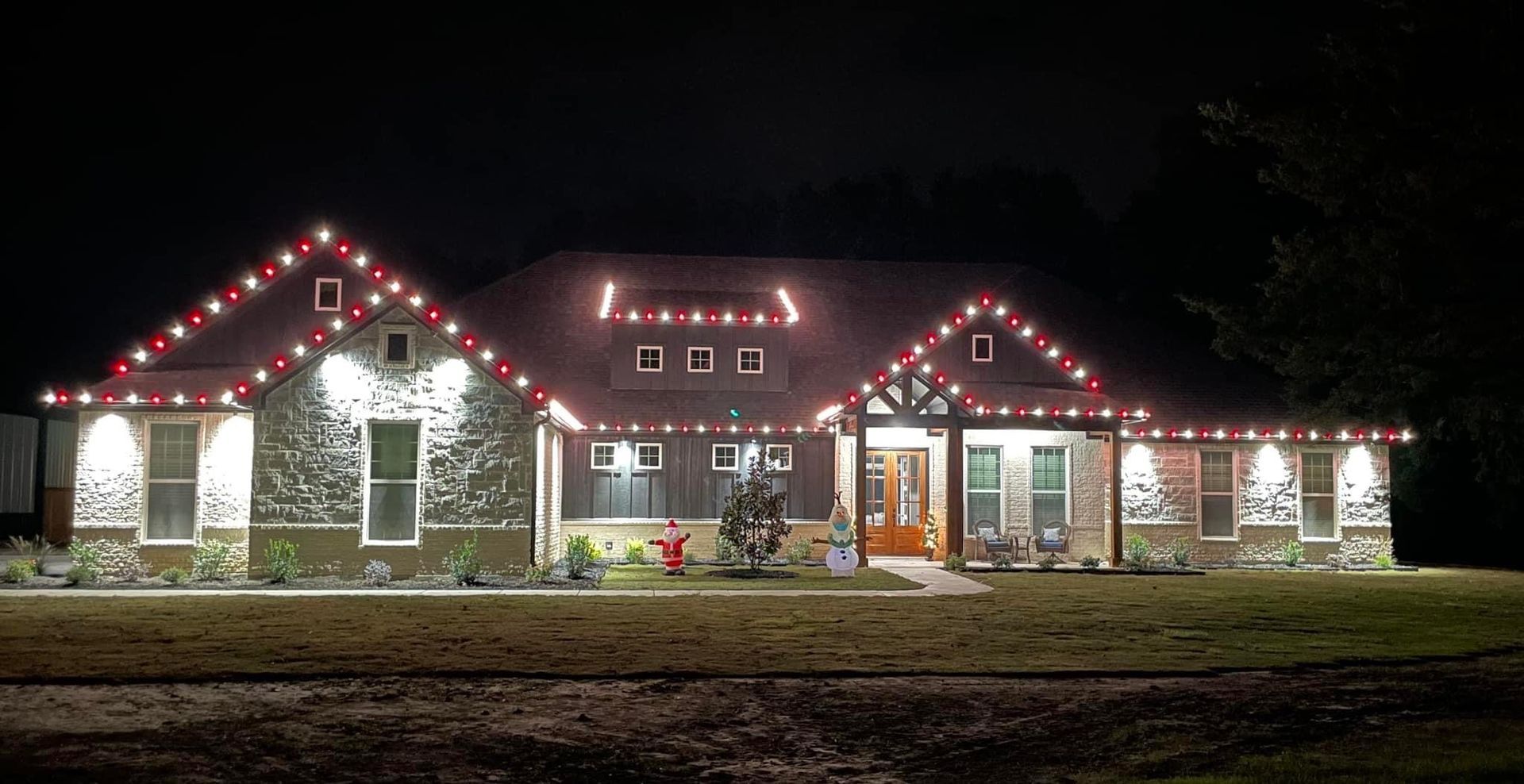 red and white christmas lights country home