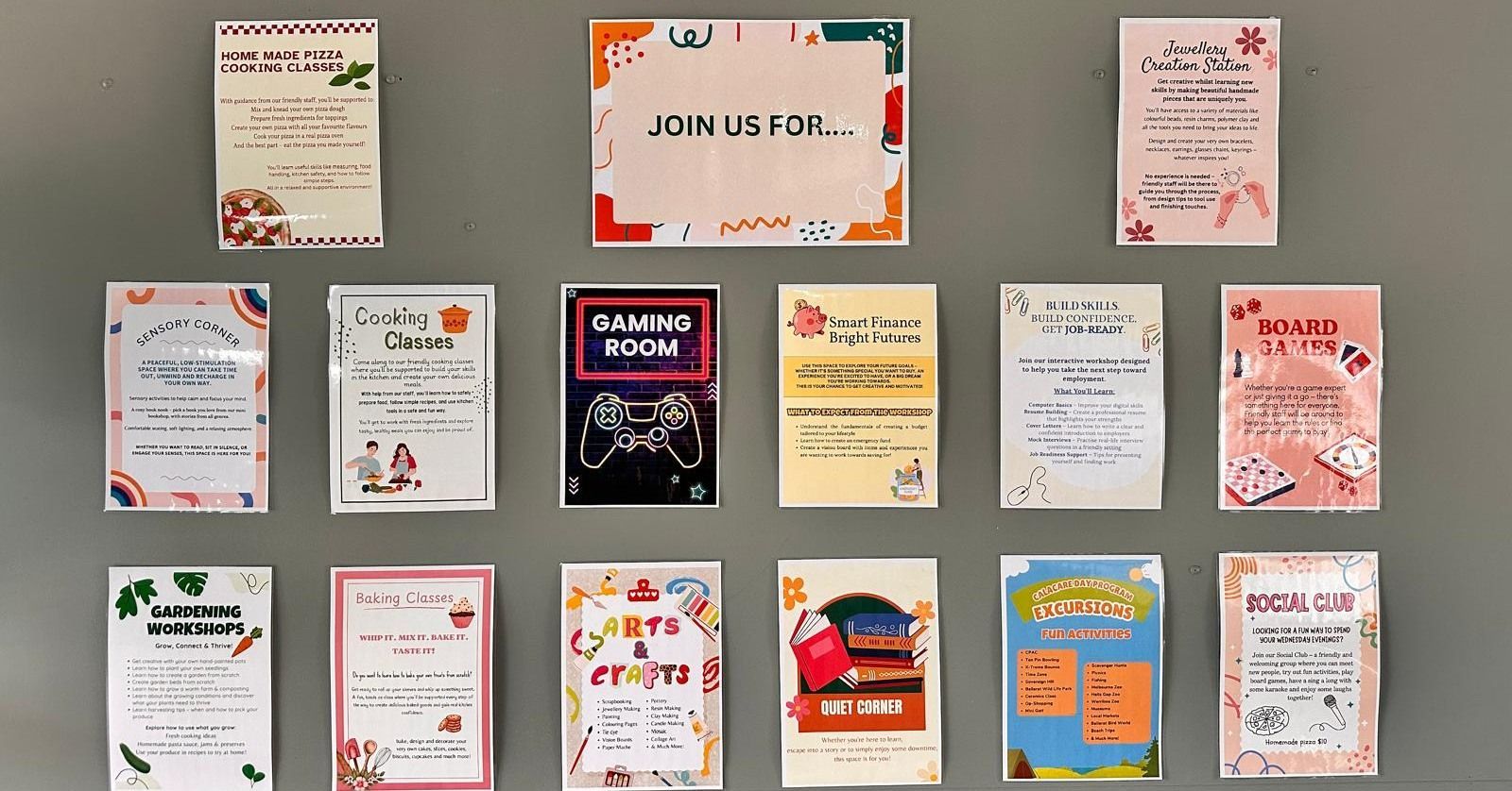 Wall with colorful flyers promoting various events.