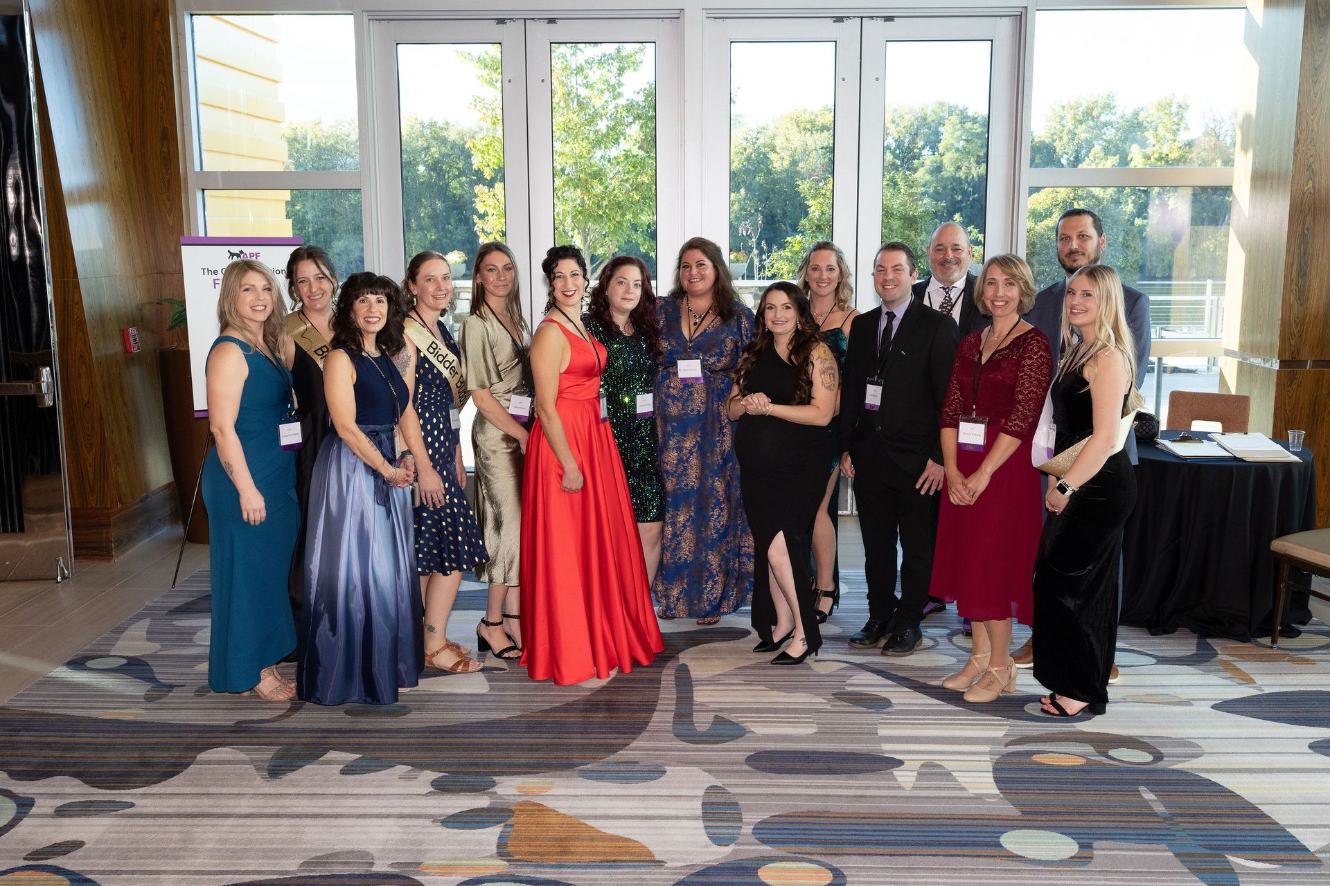 A group of people are posing for a picture in a room.