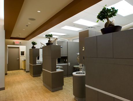 A dental office with a lot of cabinets and sinks