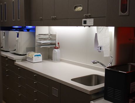 A kitchen with a sink and a lot of cabinets