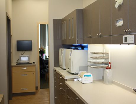A kitchen with a lot of cabinets and appliances