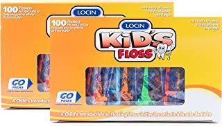 A box of kids floss is sitting on top of a table.
