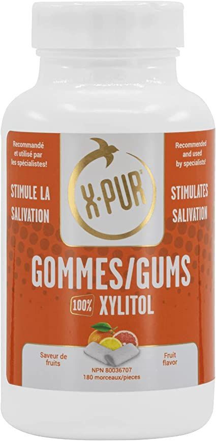 A bottle of gommes / gums with xylitol on a white background.
