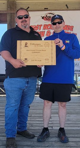 Two men standing next to each other holding a certificate