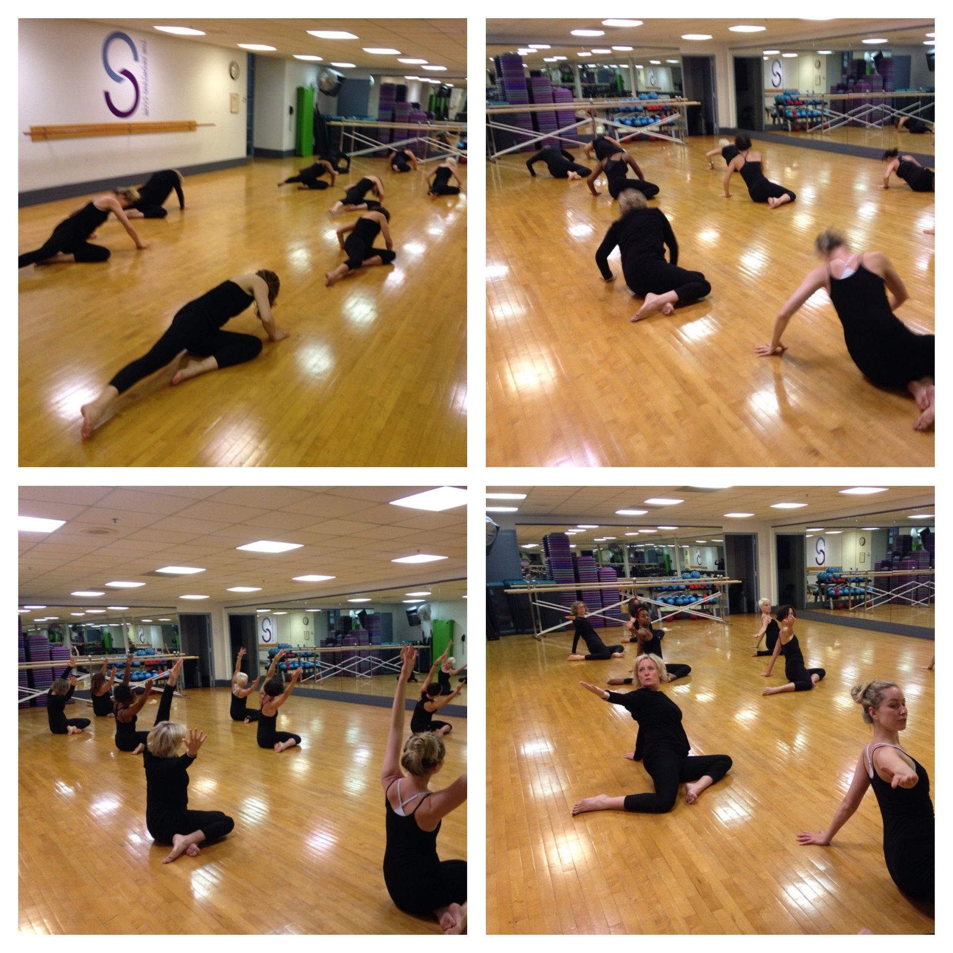 A group of people are doing stretching exercises in a dance studio