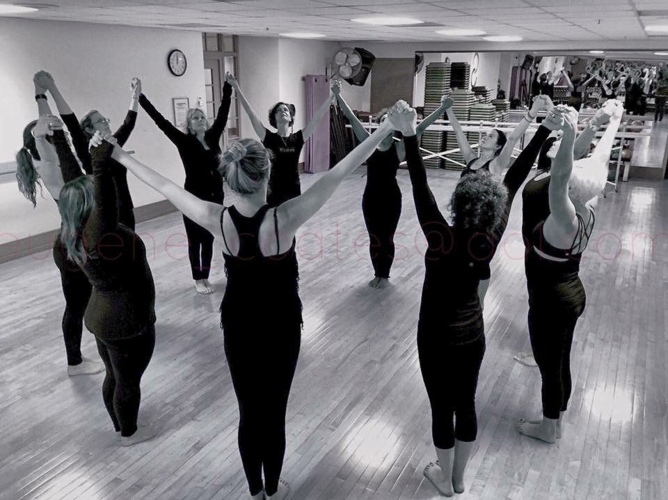 A group of women are dancing in a dance studio