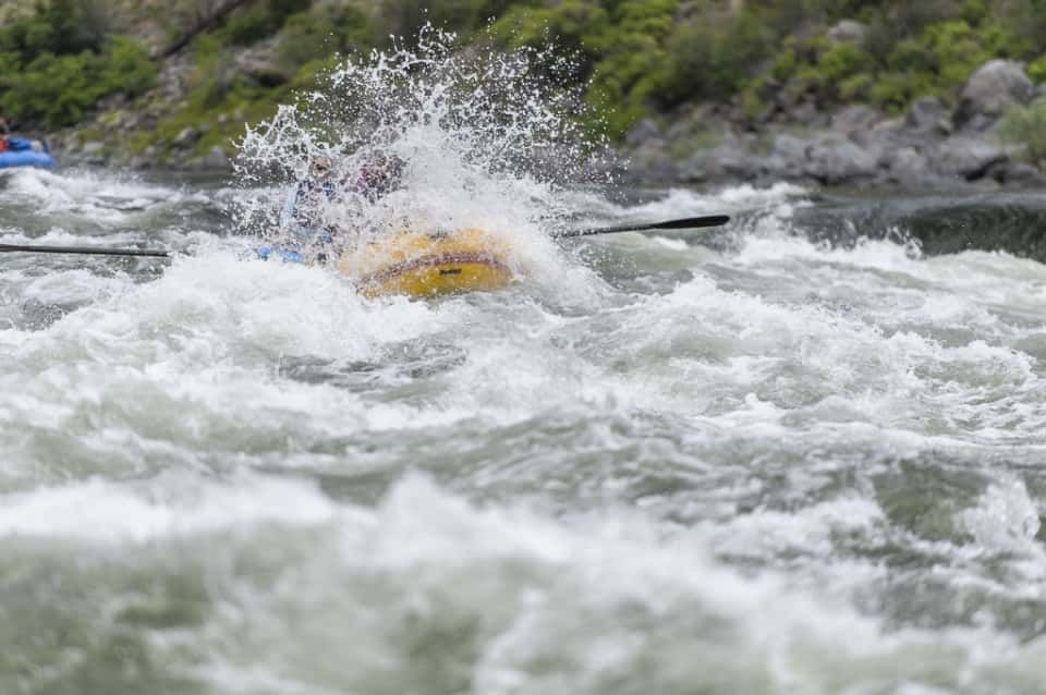 Water Splashing to The People While Rafting