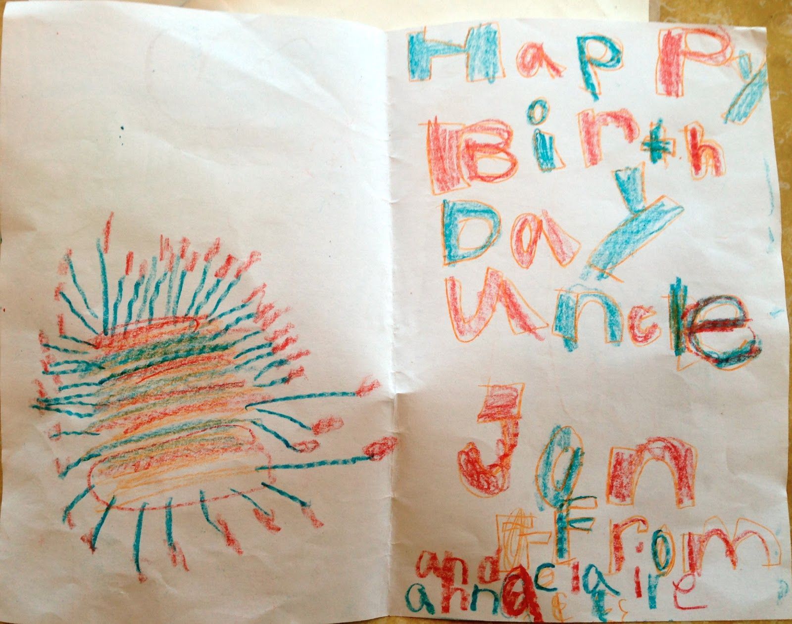 A child 's drawing of a sun and the words happy birth day uncle