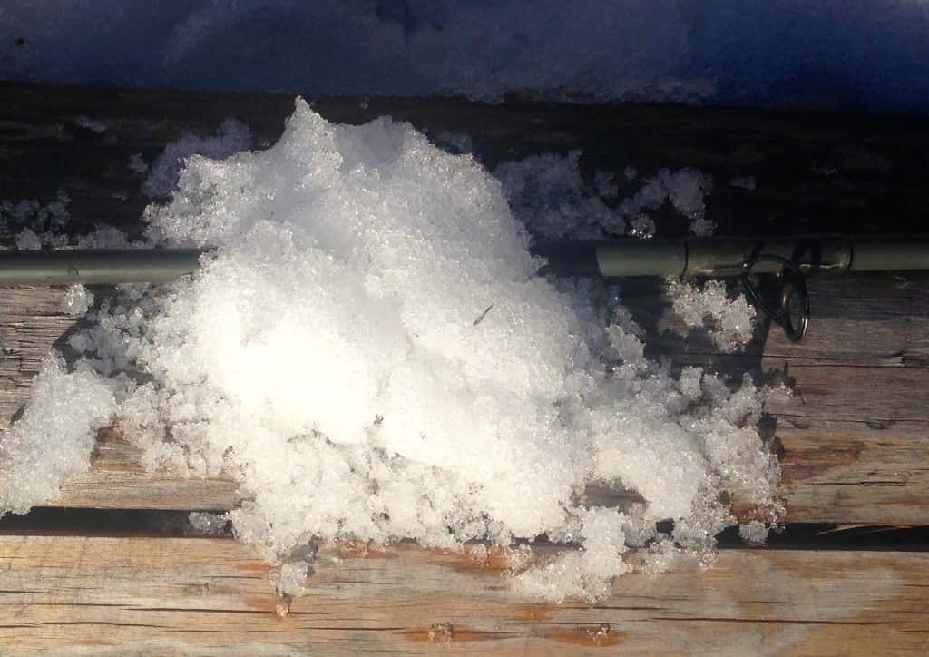 Pile of Snow Is Sitting on A Wooden Surface