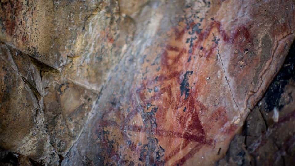 Close up Of a Rock Wall with A Painting on It