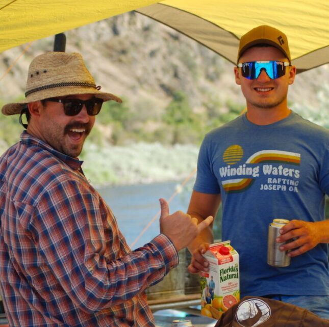 Two Man Wearing Hat and Sunglasses