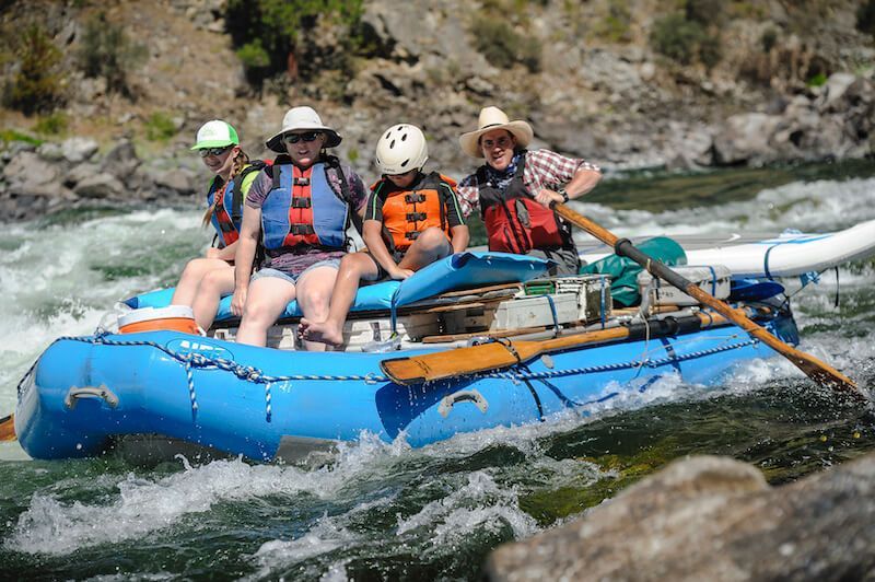 Four Person on Blue Raft