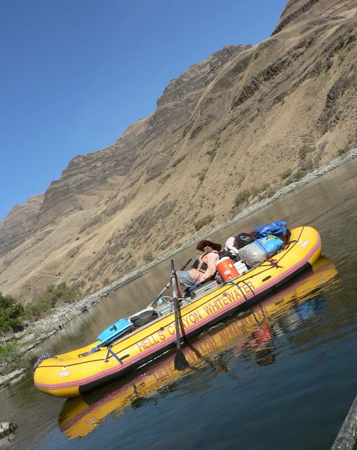 A Man Sitting in A Yellow Raft
