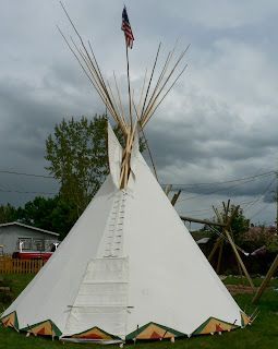 Tepee with An American Flag on Top of It