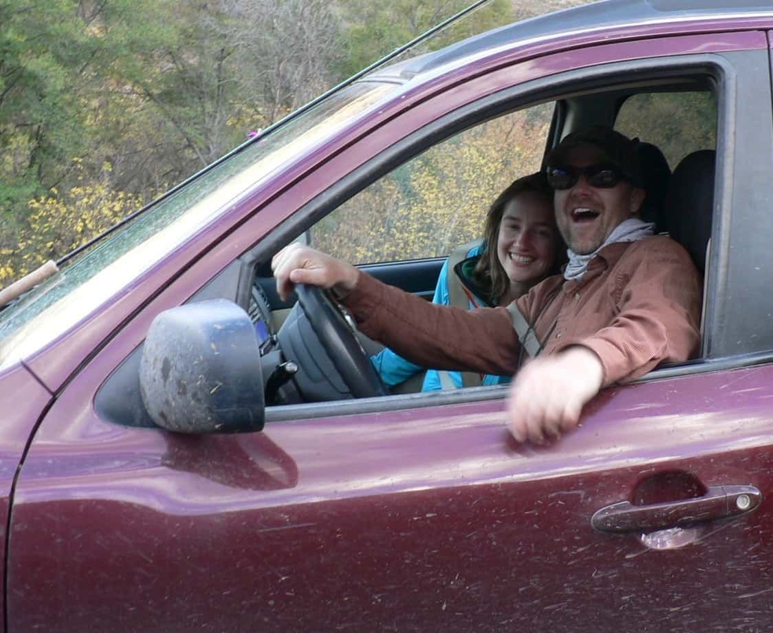 Man and A Woman Are Laughing in A Car