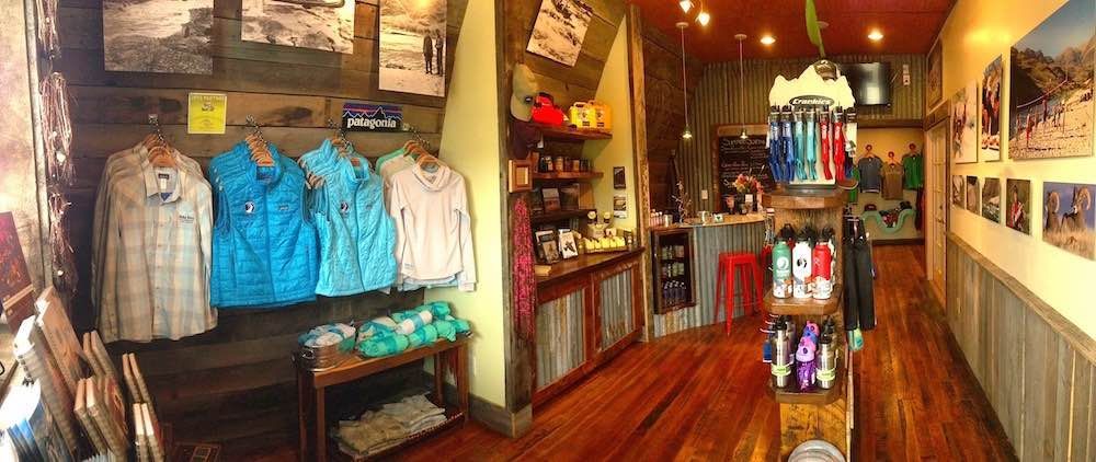 A store filled with lots of shirts hanging on the wall.