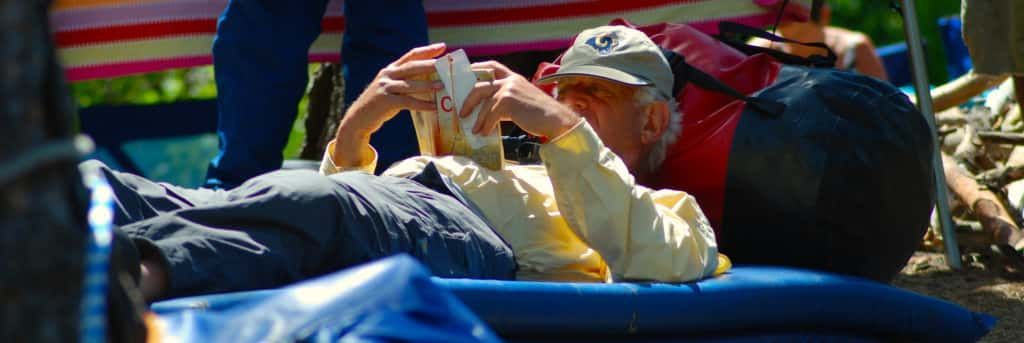 Man and A Woman Laying on A Blue Mattress