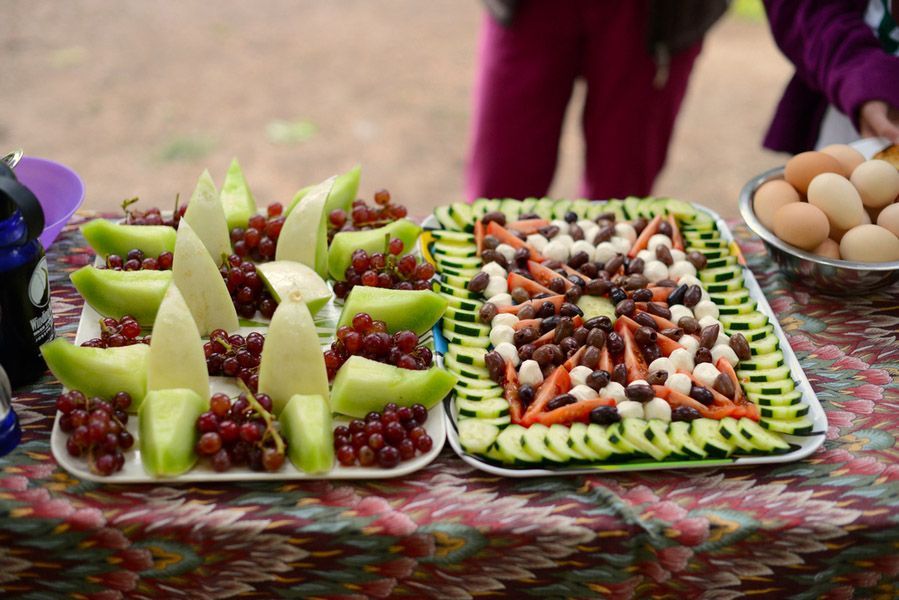 Table with Plates of Fruit and Vegetables