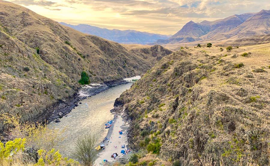 River Runs Through a Canyon Between Two Mountains