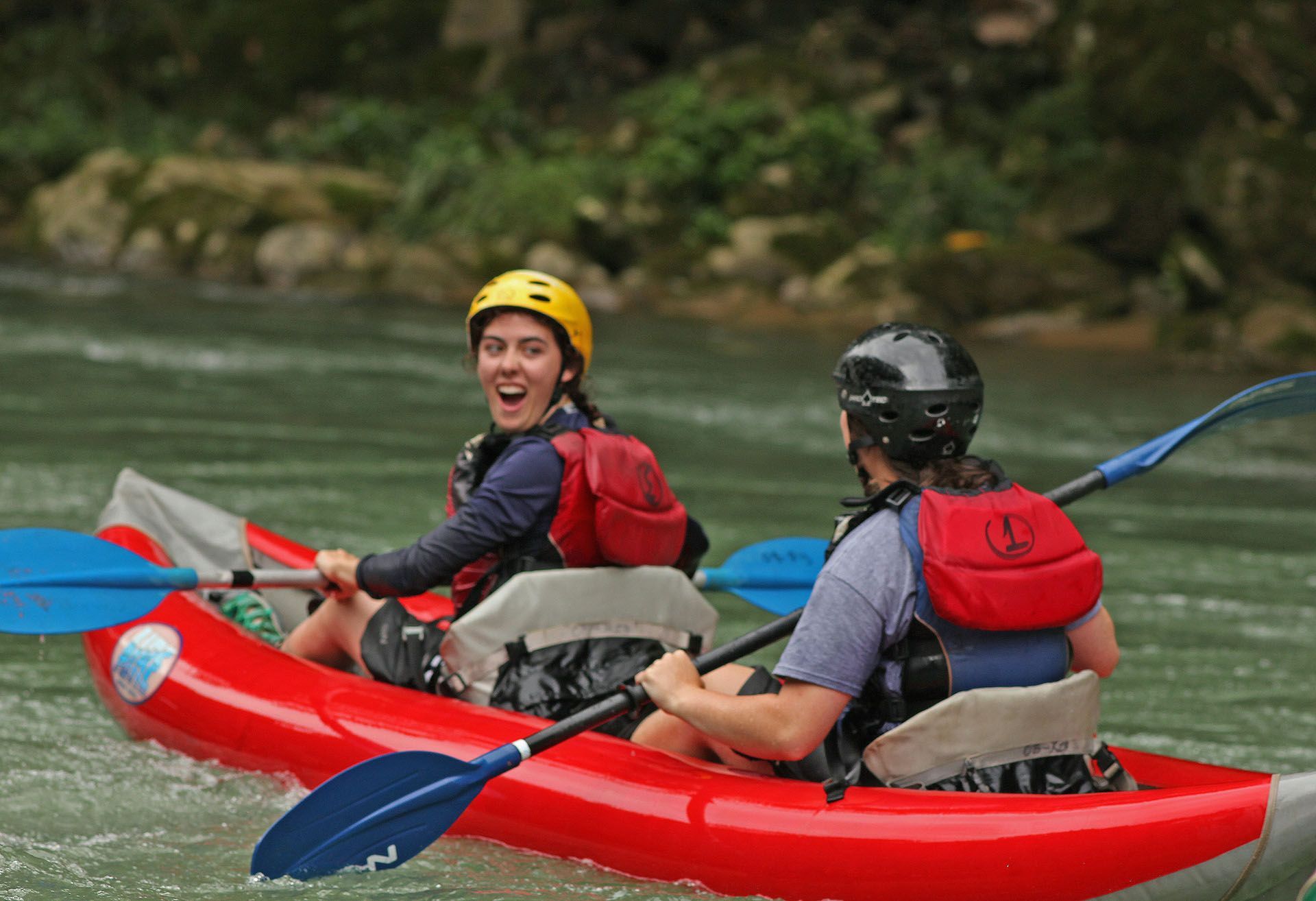 a couple in a red raft 