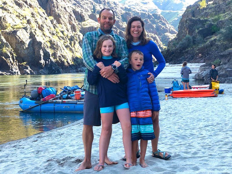 Family Posing for A Picture on The Beach Near a River