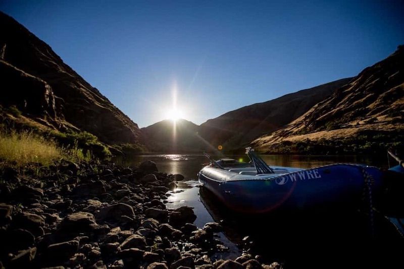 Boat Is Sitting on the Shore of A River