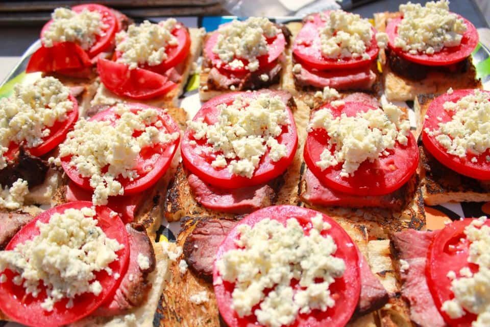 Close up Of a Sandwich with Tomatoes and Cheese on A Table