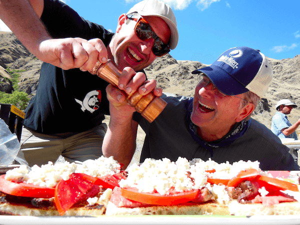 Two Man Putting Seasoning to the Food