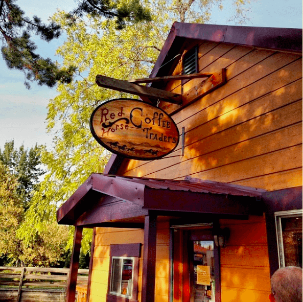 Wooden Building with A Sign that Says Red Coffee