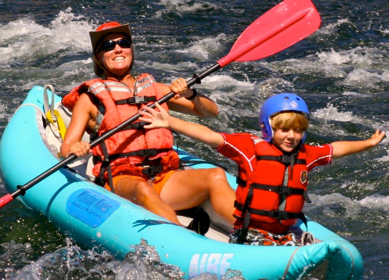 a kid in a blue raft