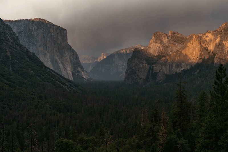 Sun is Shining Through the Clouds on The Mountains