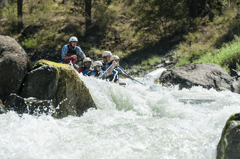 A group of people are rafting down a river.
