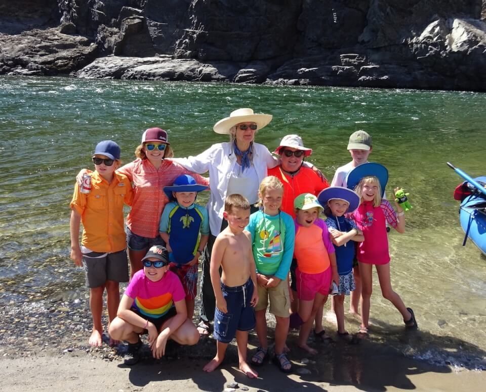 Family Posing for A Picture in Front of A River