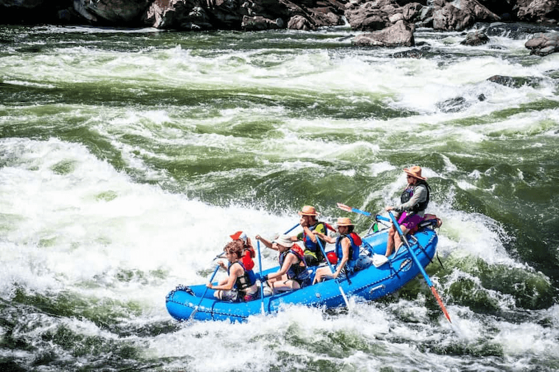 A group of people are rafting down a river.